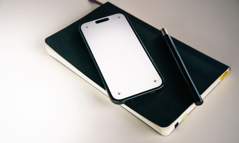 Smartphone and notebook ready for a calling-app checklist